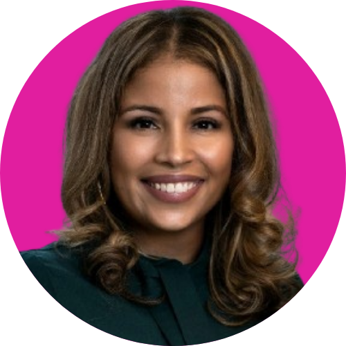 Professional headshot of a smiling woman with wavy brown hair, wearing a dark green blouse, posed against a magenta circular background.