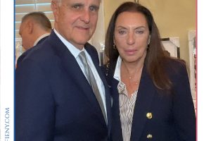 Cover photo for Top Lawyers of Long Island 2026 featuring a man in a navy suit and a woman in a dark blazer posing together at a formal event.