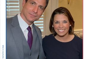 Two well-dressed people smile for a photo at a professional awards event, with 'Top Lawyers of Long Island' branding above and a decorative border.