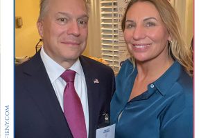 Two professionally dressed individuals posing for a photo at the 2026 Top Lawyers of Long Island event, with visible name badges and smiles.