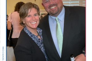 Smiling man and woman in formal attire posing at a 2026 Top Lawyers of Long Island award event.