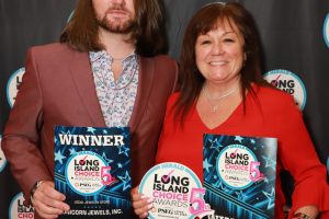 Two winners pose in front of a step-and-repeat backdrop, each holding Long Island Choice Awards winner plaques.