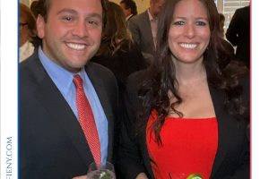 Man and woman in formal attire smiling at a cocktail party, each holding a drink, at the 2026 Top Lawyers of Long Island event.