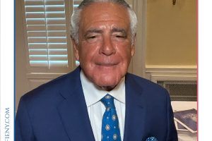Portrait of Edward L. Lieberman in a blue suit at a Top Lawyers of Long Island event, wearing a name badge.