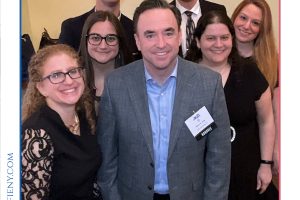Group of seven professionals smiling for a photo at the 2026 Top Lawyers of Long Island event.