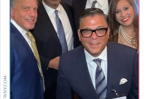 Group of five professionally dressed individuals posing for a photo at the 2026 Top Lawyers of Long Island event, smiles all around.