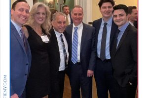 Six professionally dressed individuals posing for a group photo at a formal event, the Top Lawyers of Long Island 2026 gathering.